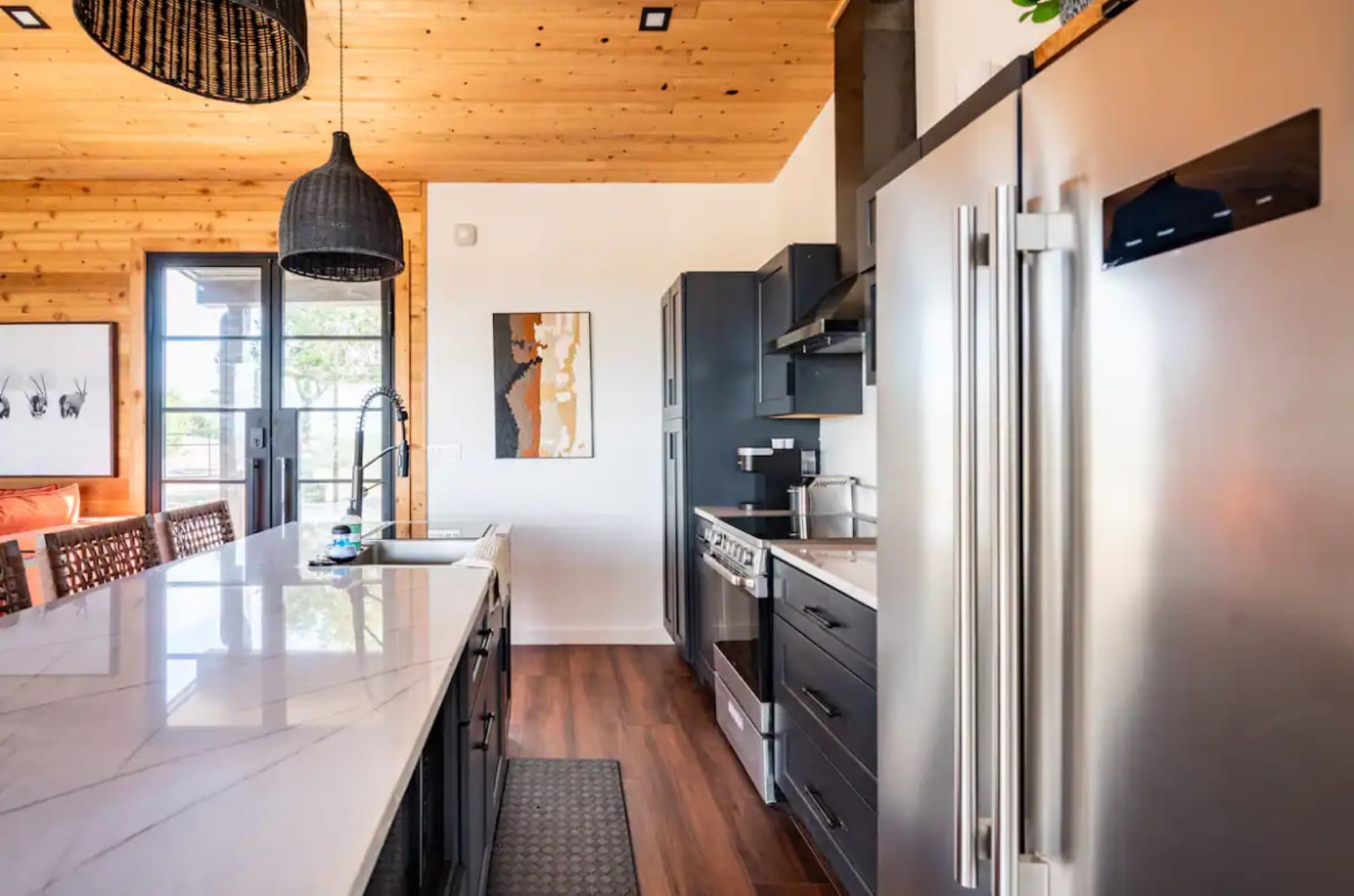 The cabin kitchen looking toward the range and the glass doors